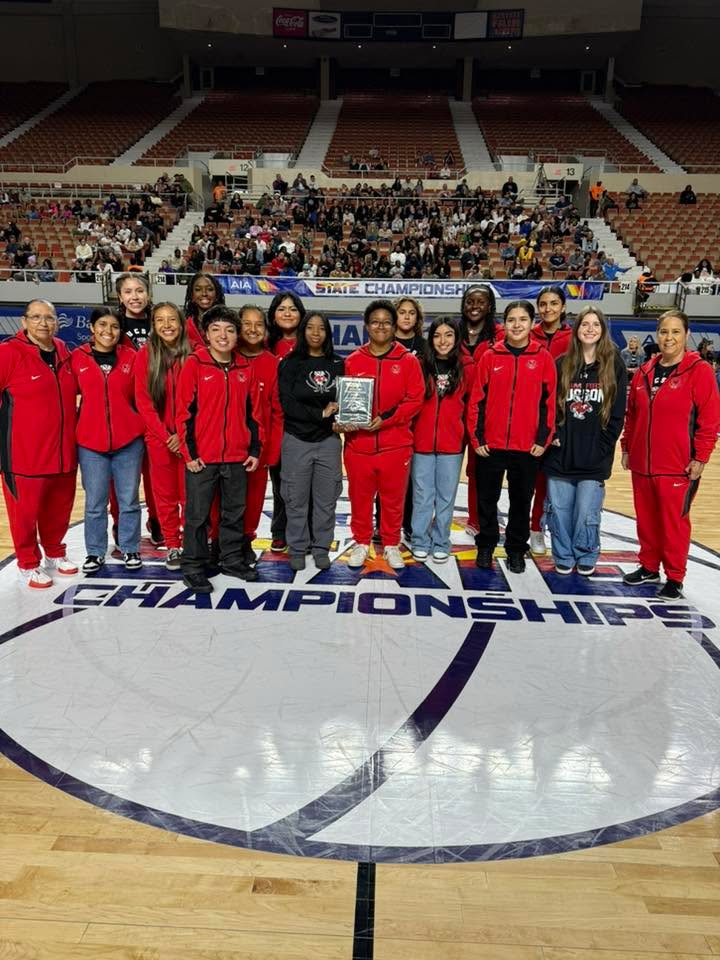 The Tucson High girls basketball team with their award plaque