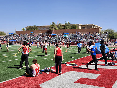 Track athletes on the field at Tucson High