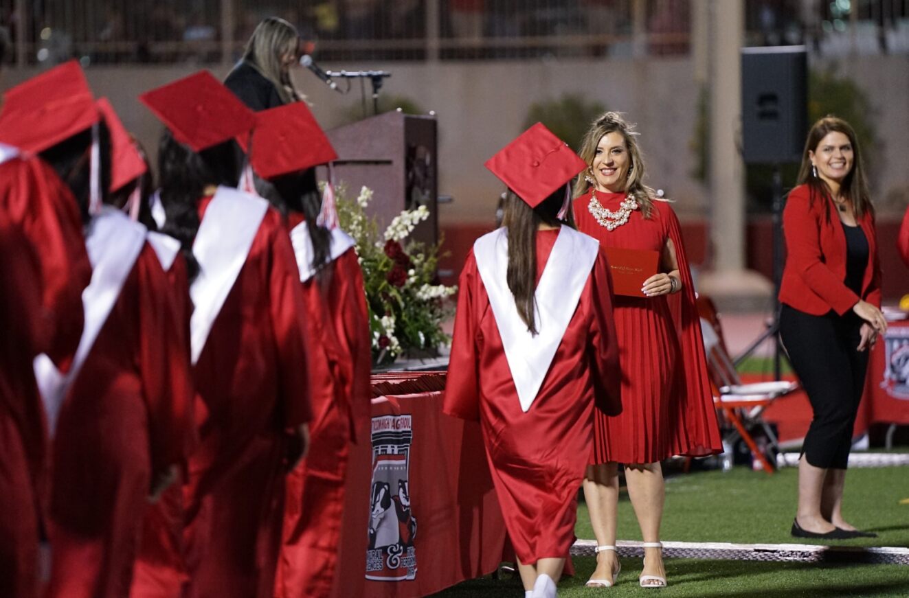 Tucson High grads walk up to get their diplomas